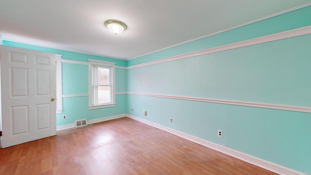 empty room with hardwood / wood-style flooring