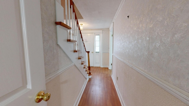 interior space featuring hardwood / wood-style floors and ornamental molding