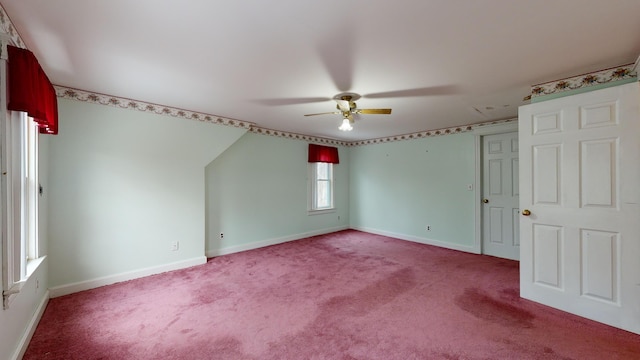 unfurnished room featuring ceiling fan and carpet