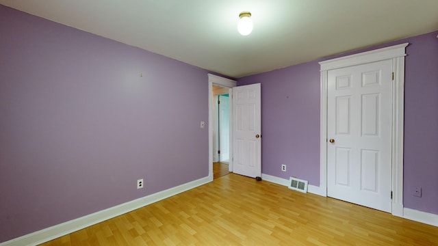 unfurnished bedroom featuring hardwood / wood-style floors