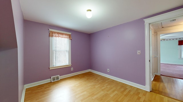 unfurnished room featuring wood-type flooring