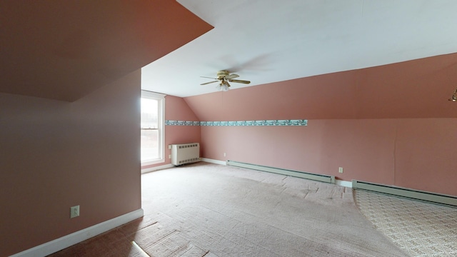 bonus room featuring a baseboard radiator, ceiling fan, vaulted ceiling, and carpet flooring