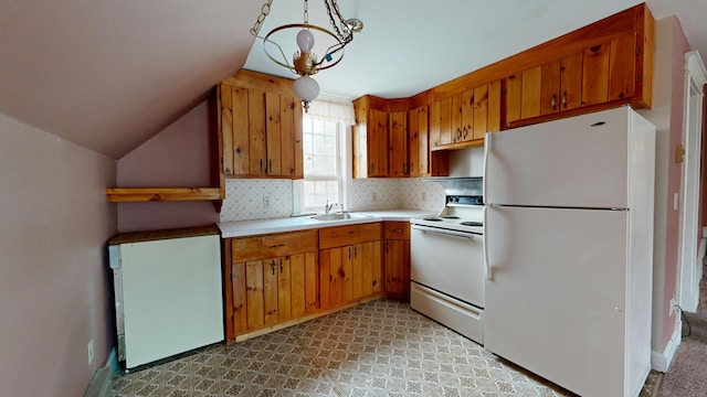 kitchen with white appliances, pendant lighting, a notable chandelier, lofted ceiling, and sink