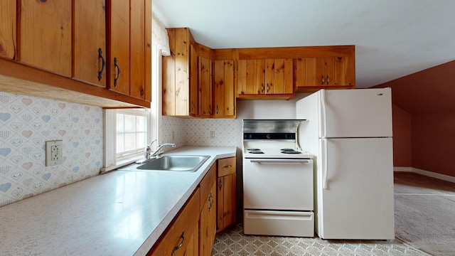 kitchen featuring sink and white appliances