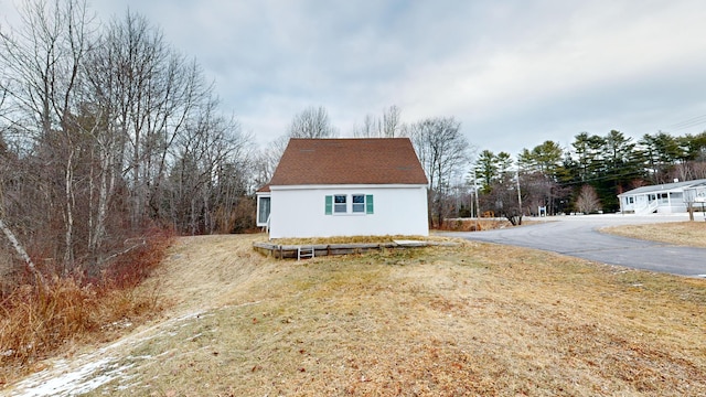 view of property exterior featuring a yard