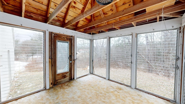 unfurnished sunroom with lofted ceiling