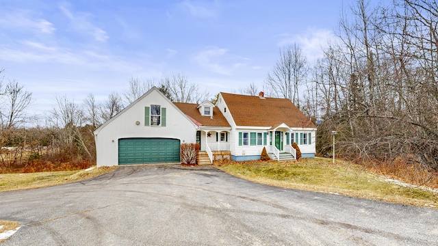 cape cod house with a garage