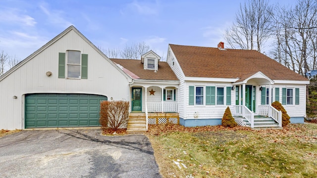 view of front of house featuring a front yard and a garage