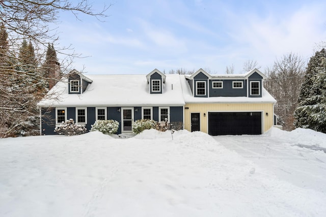 new england style home with a garage