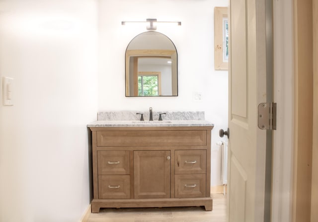 284 Flanders Pond Rd, Sullivan, ME 04664 - bathroom with vanity and wood finished floors