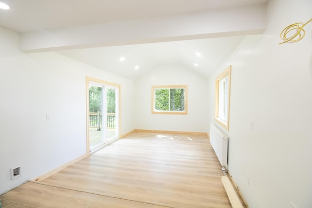284 Flanders Pond Rd, Sullivan, ME 04664 - spare room featuring radiator, light wood-type flooring, recessed lighting, and vaulted ceiling