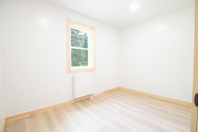284 Flanders Pond Rd, Sullivan, ME 04664 - spare room with radiator and wood finished floors