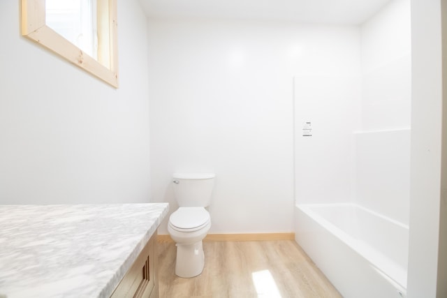 284 Flanders Pond Rd, Sullivan, ME 04664 - bathroom featuring wood finished floors, vanity, and shower / washtub combination