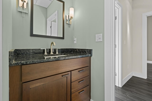 bathroom featuring vanity and hardwood / wood-style flooring