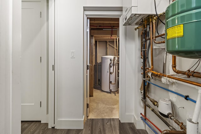 utility room featuring water heater