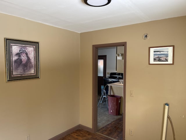 corridor featuring dark hardwood / wood-style flooring