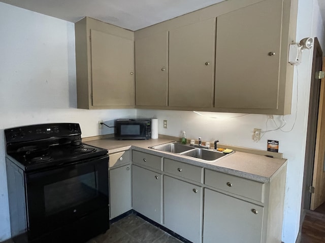 kitchen featuring gray cabinetry, sink, and black appliances