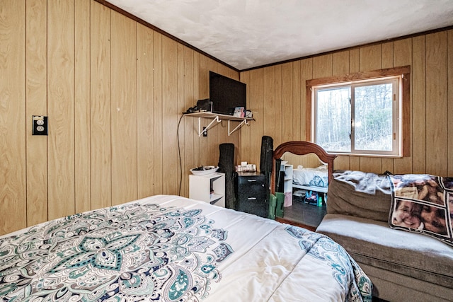 bedroom with wooden walls and crown molding