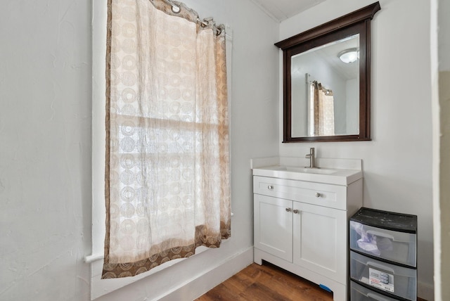 bathroom featuring vanity and hardwood / wood-style flooring