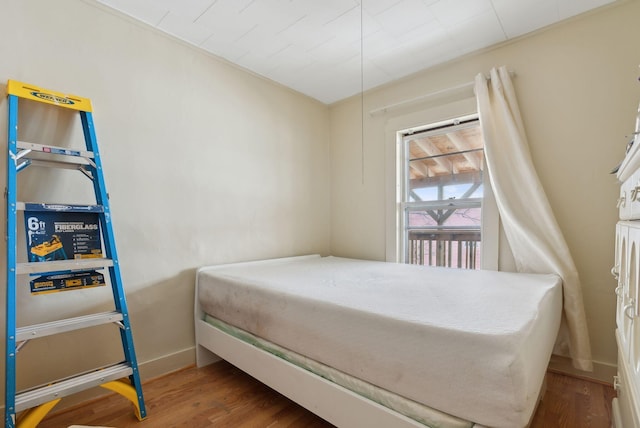 bedroom with wood-type flooring