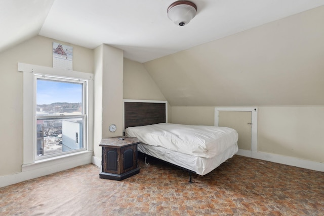 bedroom featuring lofted ceiling