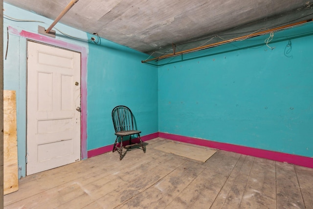 basement with wood-type flooring