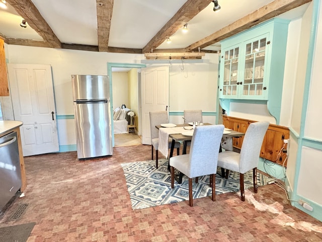 dining room featuring beam ceiling