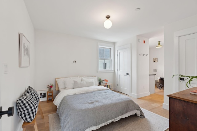 bedroom with light wood-type flooring