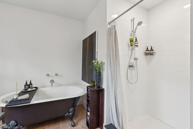 bathroom with plus walk in shower and hardwood / wood-style flooring