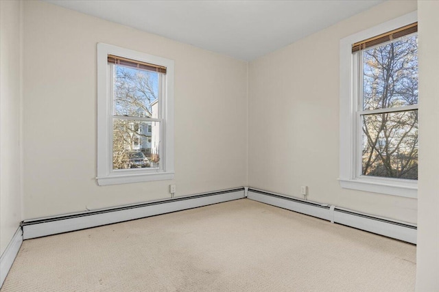 carpeted empty room with a baseboard radiator