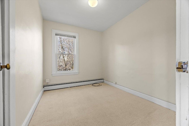 unfurnished room with a baseboard radiator and light colored carpet