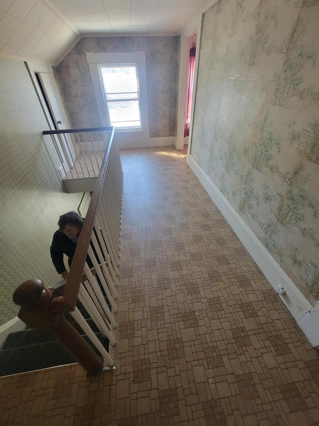 hallway featuring vaulted ceiling