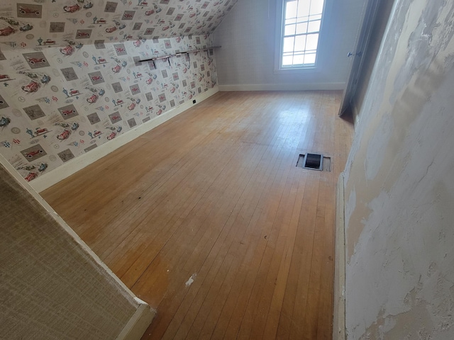 bonus room featuring hardwood / wood-style flooring