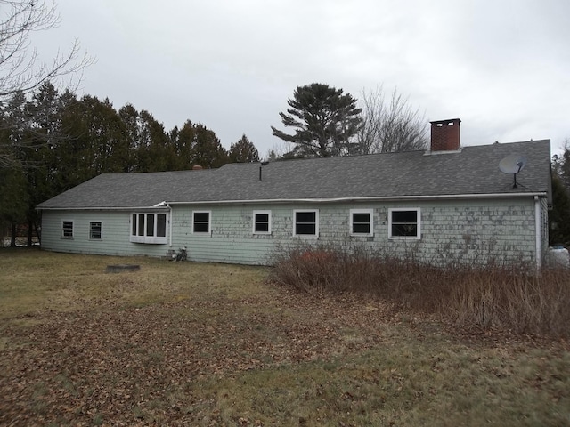 back of house with a yard