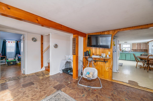 living room with wooden walls