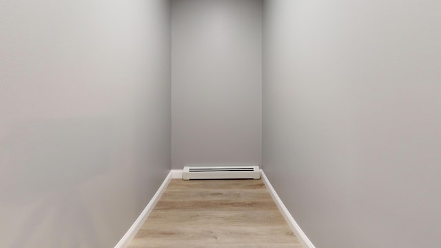 interior space with a baseboard radiator