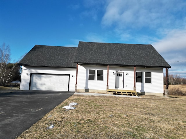 view of front of home featuring a garage and a front lawn