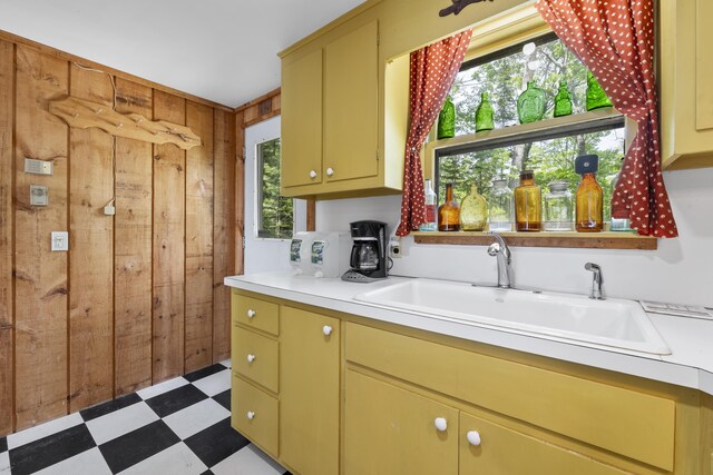 36 Storer Rd, Bremen, ME 04551 - kitchen featuring tile patterned floors, wooden walls, light countertops, and healthy amount of natural light