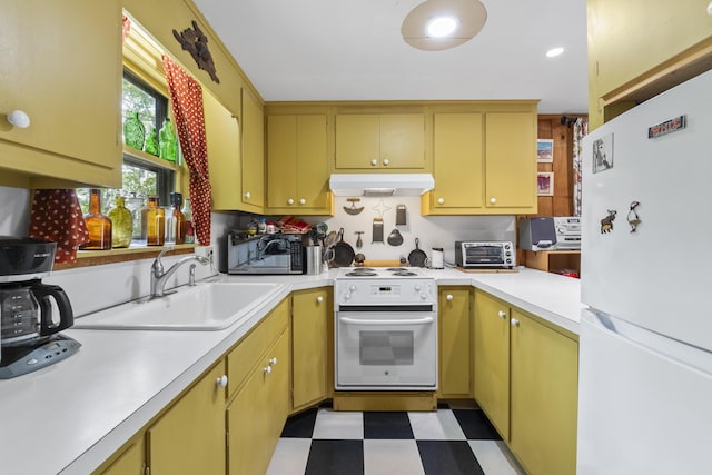 36 Storer Rd, Bremen, ME 04551 - kitchen with white appliances, under cabinet range hood, light countertops, and light flooring