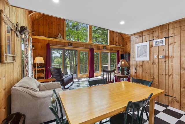 36 Storer Rd, Bremen, ME 04551 - dining area with wood walls, tile patterned floors, and vaulted ceiling