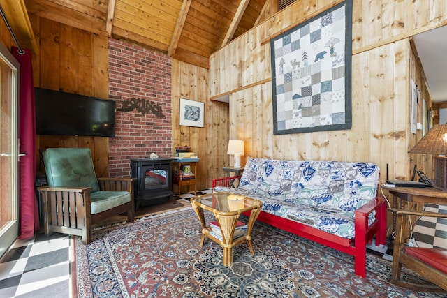 36 Storer Rd, Bremen, ME 04551 - living area featuring a wood stove, wood walls, wooden ceiling, and tile patterned floors
