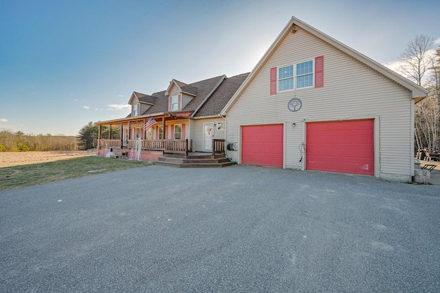 view of front facade with a porch and a garage