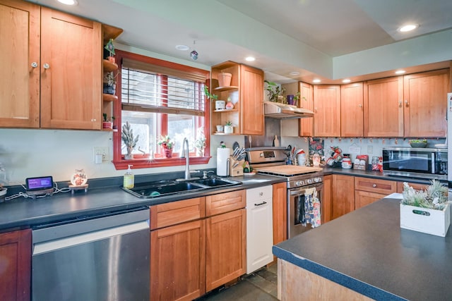 kitchen with sink, stainless steel appliances, and dark tile patterned floors