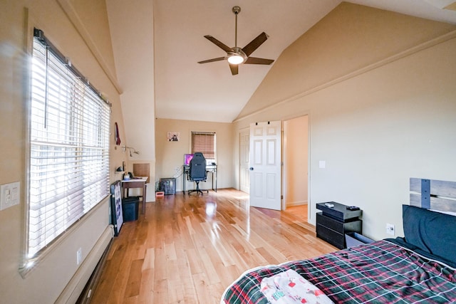 bedroom with ceiling fan, high vaulted ceiling, and wood-type flooring