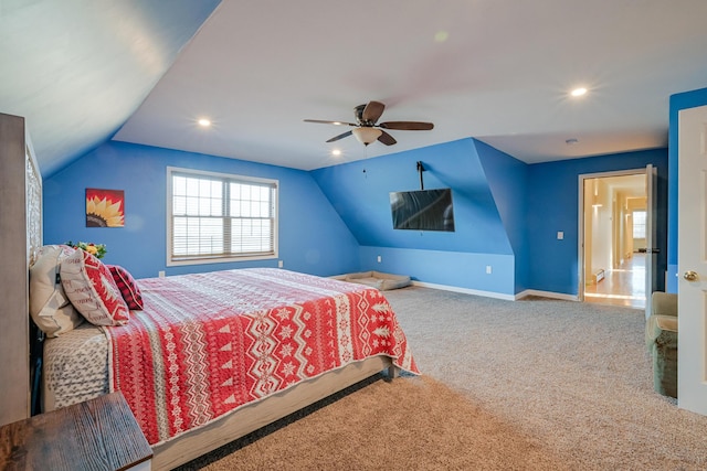 bedroom with carpet floors, ceiling fan, and vaulted ceiling