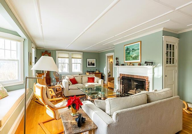 50 Peters Rd, Searsmont, ME 04973 - living area with a fireplace, ornamental molding, and wood finished floors