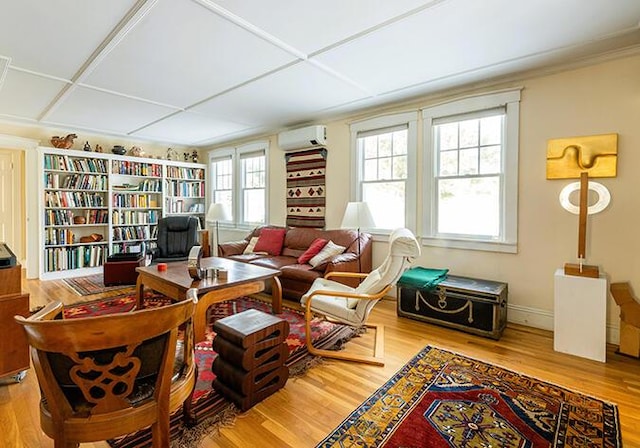 50 Peters Rd, Searsmont, ME 04973 - sitting room with a wall mounted AC, wood finished floors, and baseboards