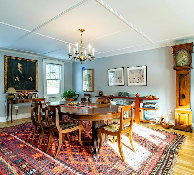 50 Peters Rd, Searsmont, ME 04973 - dining room featuring crown molding, wood finished floors, an inviting chandelier, and baseboards