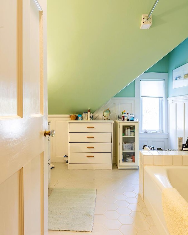 50 Peters Rd, Searsmont, ME 04973 - bathroom featuring tile patterned floors, a bath, and lofted ceiling