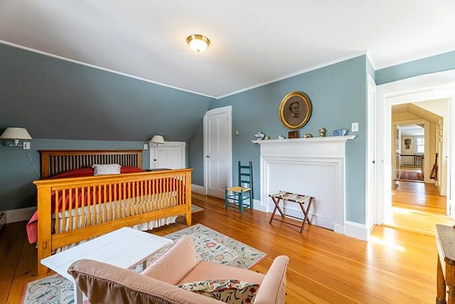 50 Peters Rd, Searsmont, ME 04973 - bedroom featuring crown molding, wood finished floors, baseboards, and vaulted ceiling